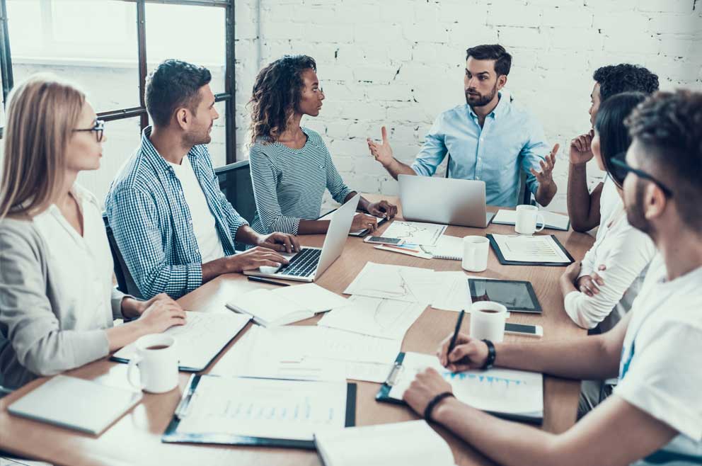 group of people meeting at a table